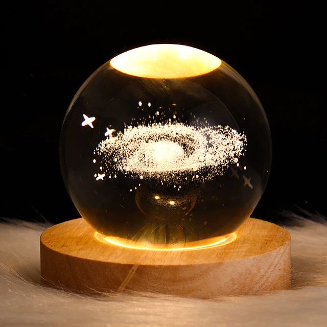 GLOWING PLANETARY GALAXY ASTRONAUT CRYSTAL BALL